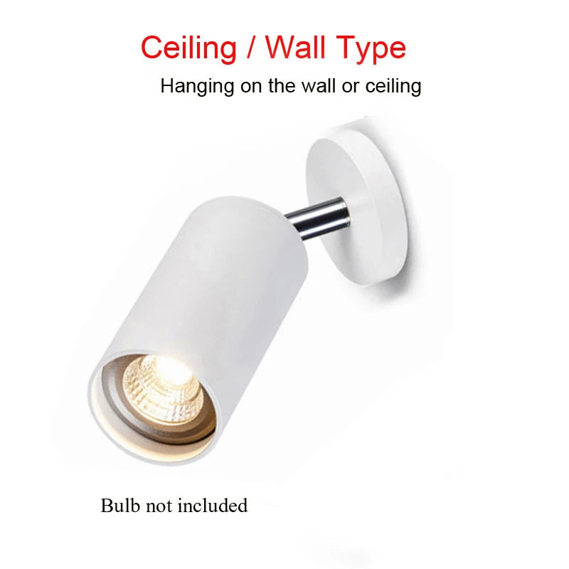 lampe de chevet noir et or mur blanc